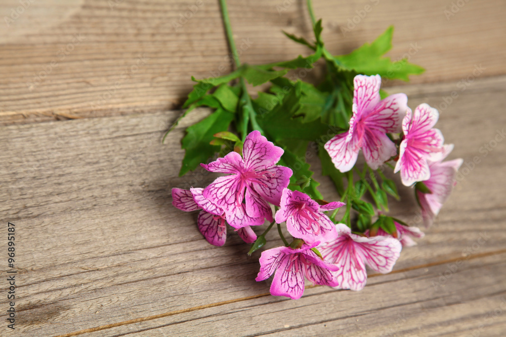 fresh flowers on a wooden table background