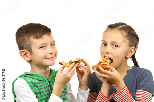 Children eating pizza isolated on white
