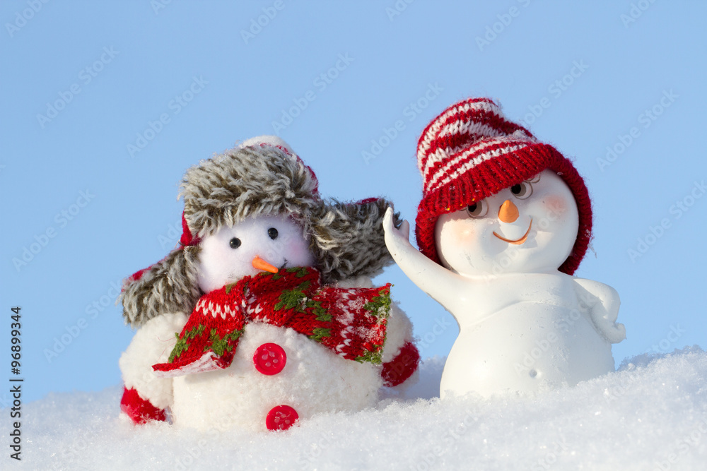two Snowmen in clothing are next two Snowmen in clothing are next