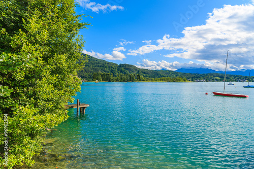 View of Worthersee lake in summer landscape of Alps Mountains, Austria
