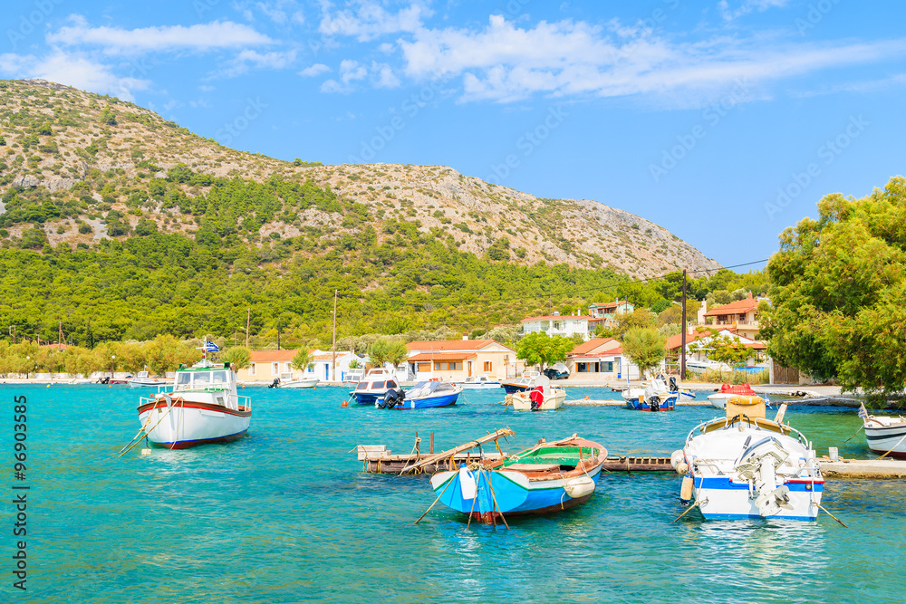 Colorful Greek fishing boats on shore in Posidonio bay, Samos island, Greece