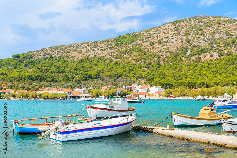 Colorful Greek fishing boats on shore in Posidonio bay, Samos island, Greece