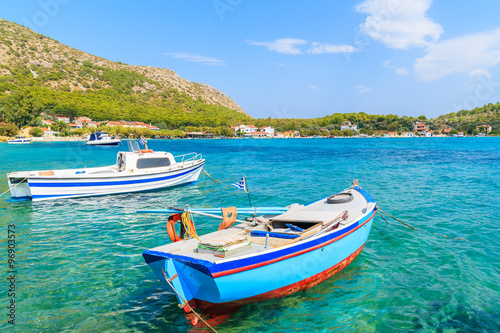 Greek fishing boats on turquoise sea water in Posidonio bay, Samos island, Greece