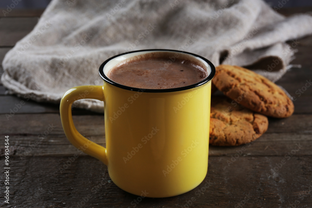 Tasty cocoa in metal old-fashioned mug and marshmallow on the table Tasty cocoa in metal old-fashioned mug and marshmallow on the table