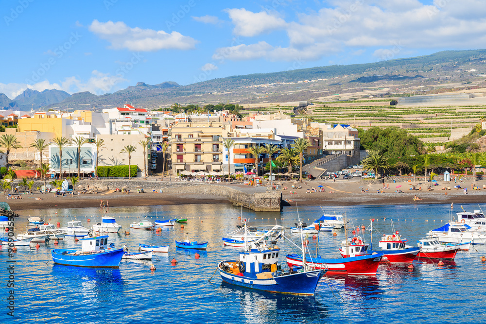 Traditional fishing boats in San Juan port with mountains in background, Tenerife, Canary Islands, Spain