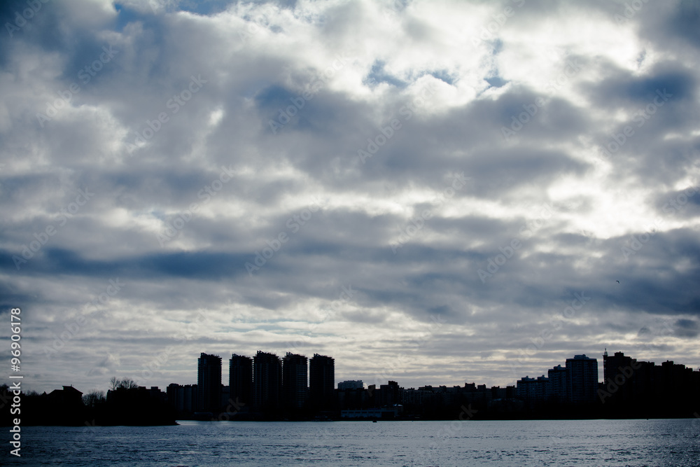 Turning the big river. Far away, backlit, you can see the city.
