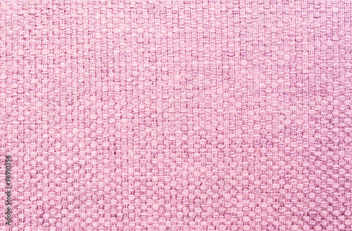 Closeup pink fabric at sofa texture background