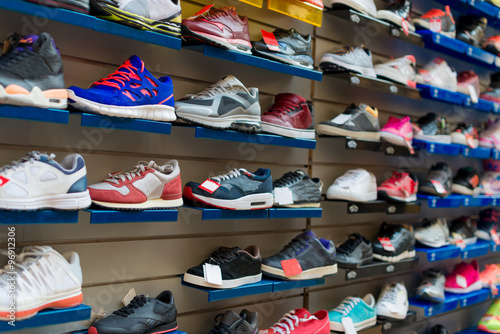 Big collection of different sport shoes.