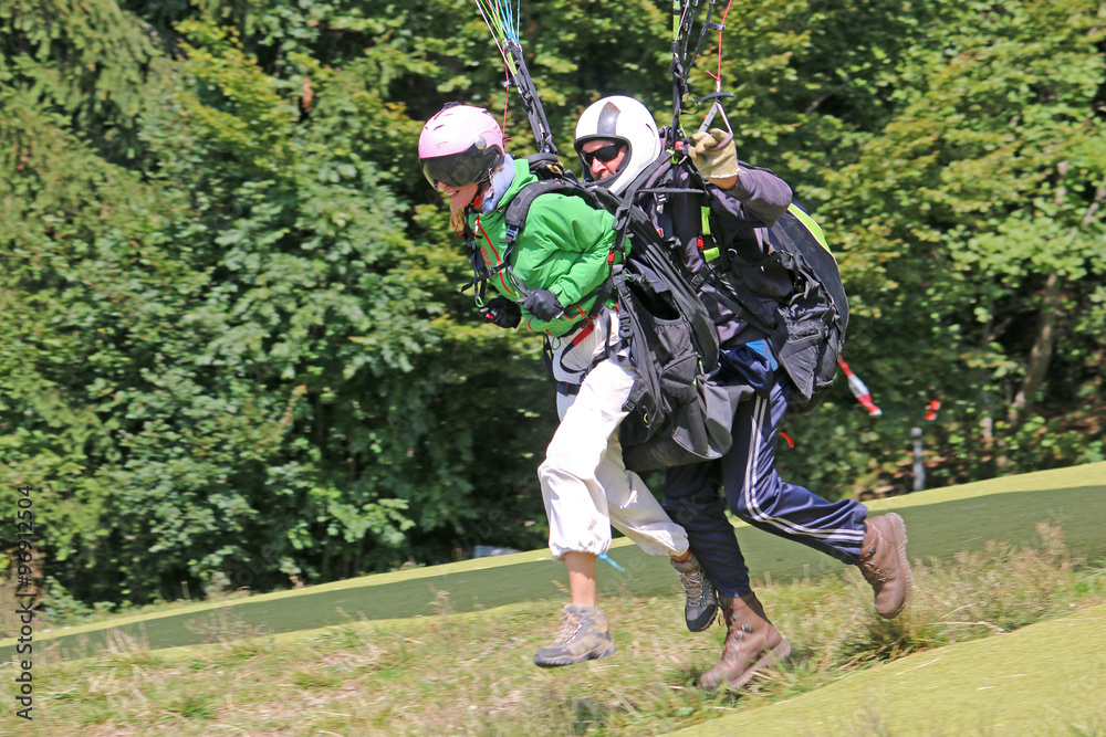 Tandem Paraglider launching