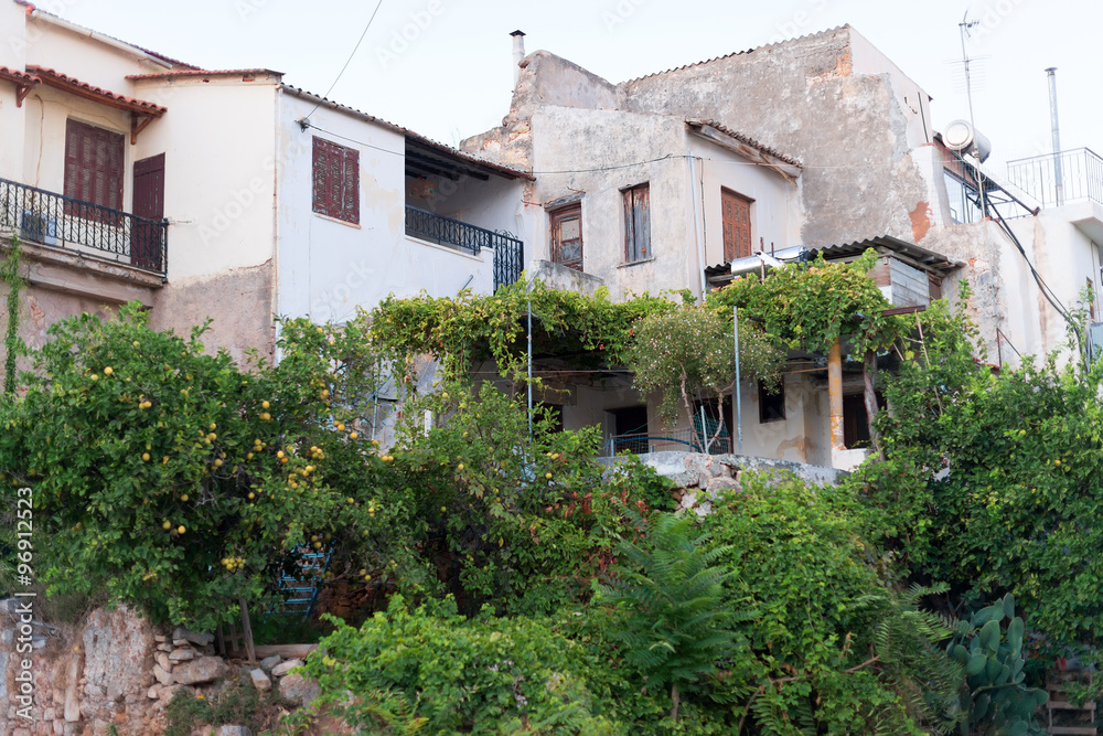 Dirty old abandoned house with overgrown shrubs. Dirty old abandoned house with overgrown shrubs.