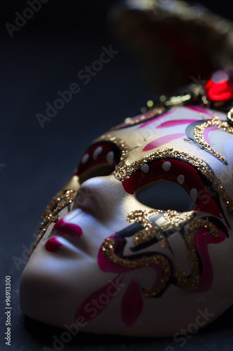 Venezian mask on a black background. Closeup