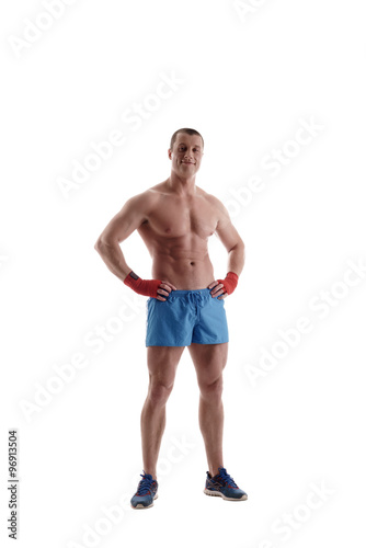 Bodybuilding. Male athlete  isolated on white