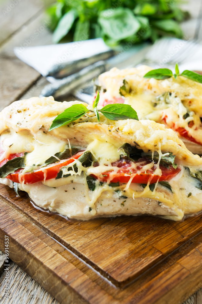 Baked chicken fillet with mozzarella, tomatoes and basil