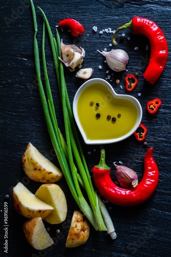 Raw potato slices with herbs, spices