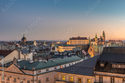Old city, royal castle and cathedral on the Wawel hill seen from the Town Hall tower in Krakow, Poland in the evening