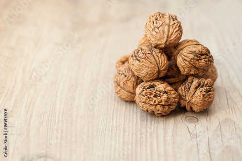 wallnuts on vintage wooden table photo