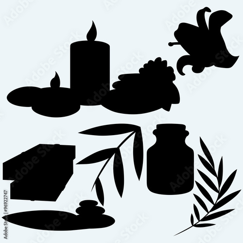 Pieces of natural soap with flower, basalt stones, candles and fragrance oil. Isolated on blue background. Vector silhouettes