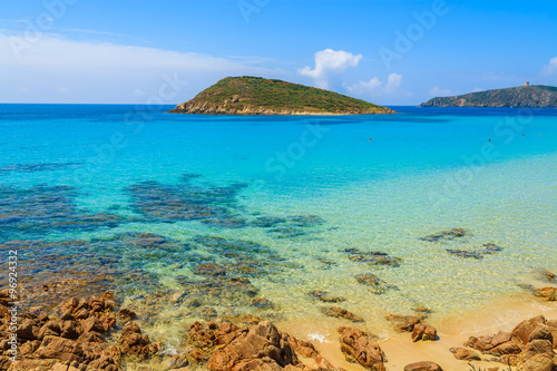 View of crystal clear sea water of Teulada beach on sunny summer day, Sardinia island, Italy