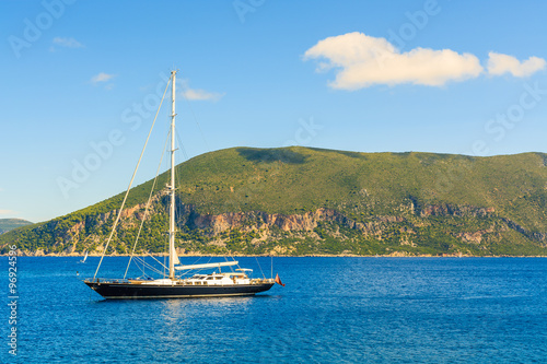 Luxury yacht boat on blue sea on coast of Kefalonia island near Fiskardo village, Greece