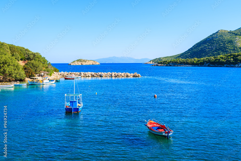 Colorful fishing boats on blue sea, Kefalonia island, Greece
