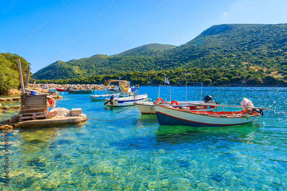 Greek fishing boats on turquoise sea water, Kefalonia island, Greece
