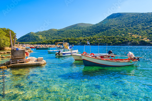 Greek fishing boats on turquoise sea water, Kefalonia island, Greece