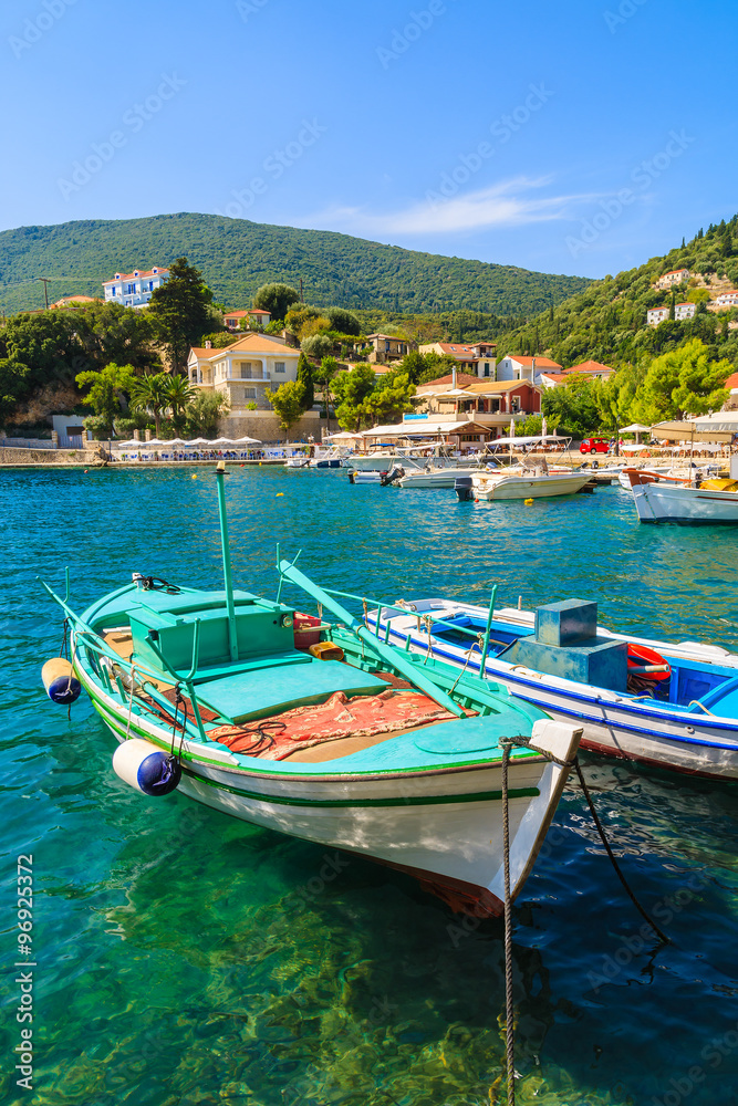 Fishing boats on turquoise sea water in Kioni port, Ithaka island, Greece