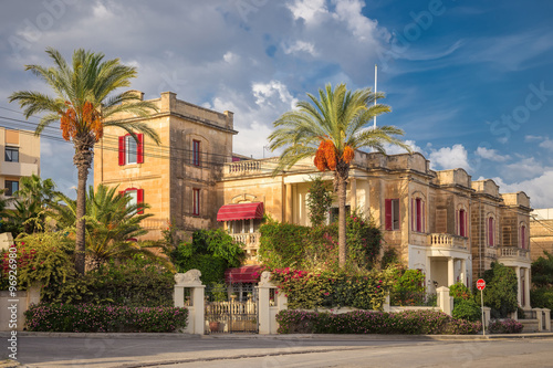 Nice traditional building at Valletta with palm trees - Malta