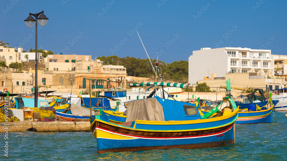 Obraz premium Colorful Luzzu fishing boats in Marsaxlokk harbor, Malta