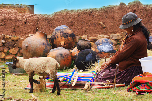 Aymara woman weaving photo