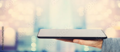 Obraz na płótnie Man holding a tablet computer