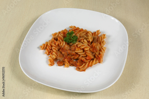 pasta with meat and herbs in sauce