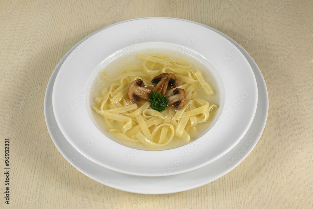 portion of mushroom soup with noodles