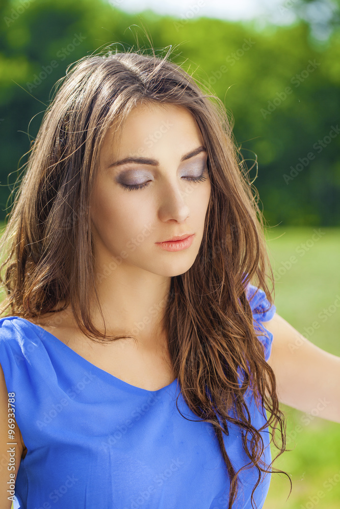 Young brunette woman outdoors portrait Young brunette woman outdoors portrait