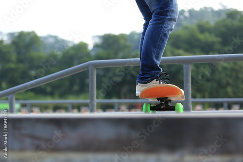 skateboarding legs at skatepark © lzf