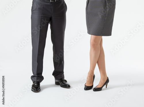 Closeup of businessman's and businesswoman's legs