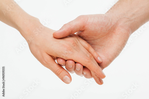 Man s hand gently holding woman s hand