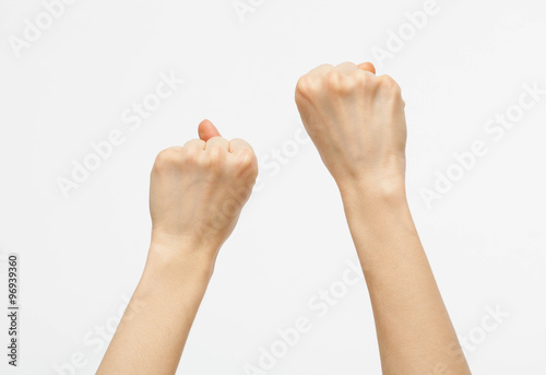 Female hands showing fists raised up