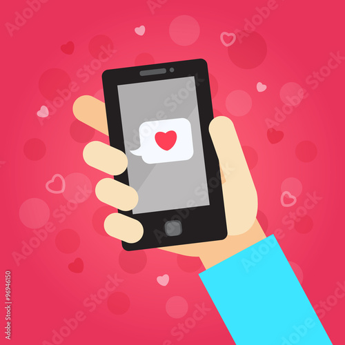 Smart phone in hand with message (love). On the pink background with hearts and dots.