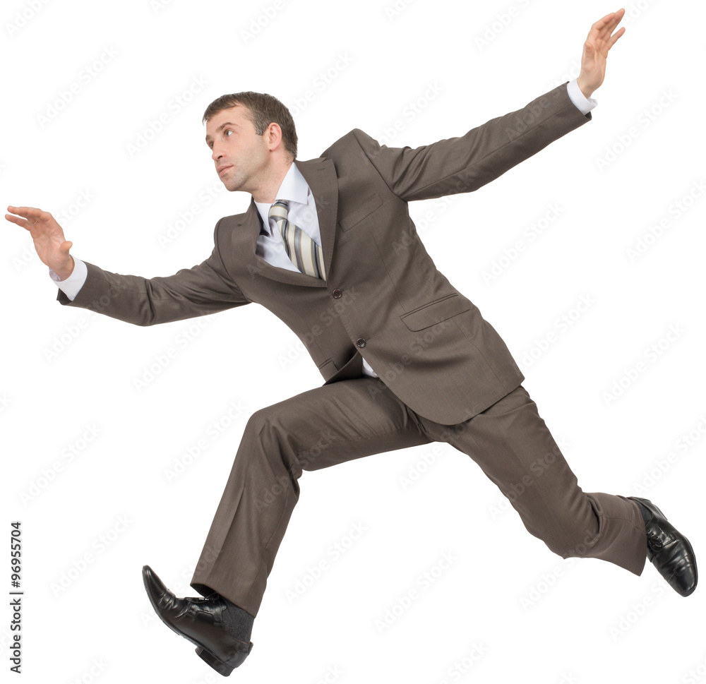 Businessman in suit running fast on white