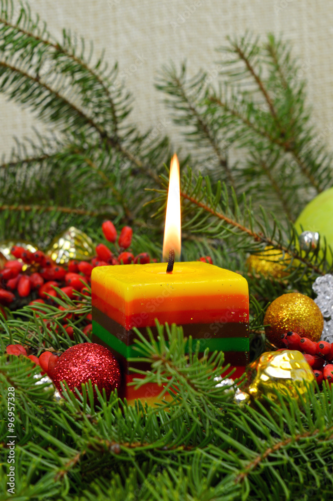 Christmas composition with a lighted candle