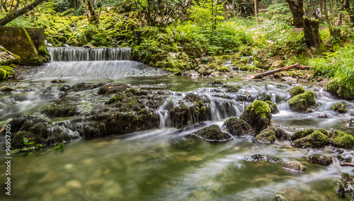 Fototapeta Naklejka Na Ścianę i Meble -  Dreamy waterfall in middle of green forest