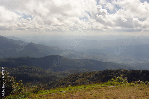 View of grass, mountain, and cloudy blue sky in Inthanon national park Chiangmai city Thailand