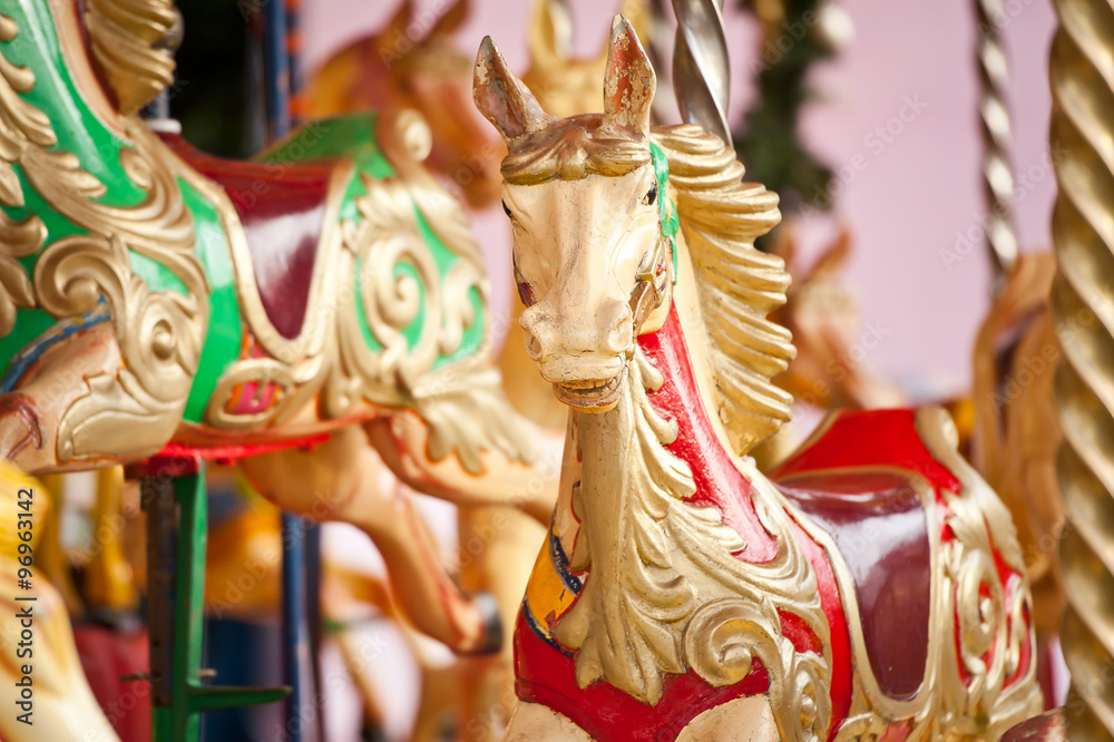 Carousel. Horses on a carnival Merry Go Round.