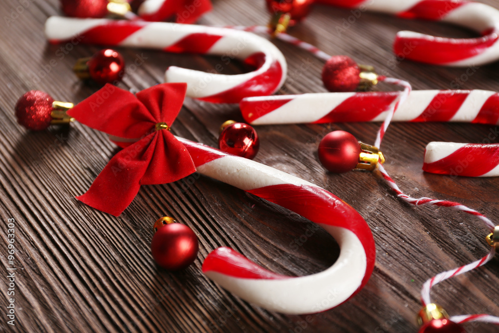 Christmas Candy Canes with Christmas decoration on table close-up Christmas Candy Canes with Christmas decoration on table close-up