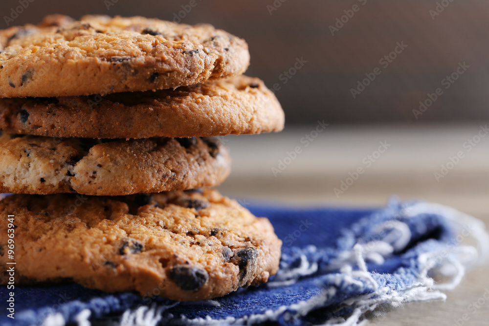 Cookies with chocolate crumbs on wooden table against blurred background, close up Cookies with chocolate crumbs on wooden table against blurred background, close up