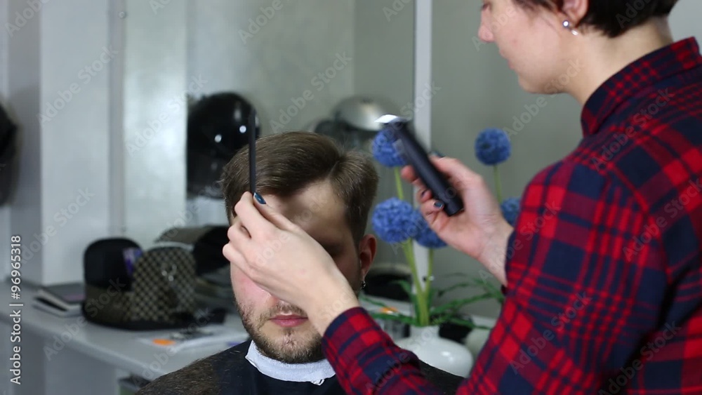 The young man at the hairdresser salon hairstyle make model The young man at the hairdresser salon hairstyle make model