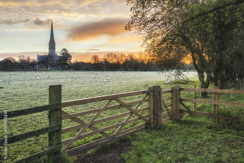 Winter frosty sunrise landscape Salisbury cathedral city in Engl