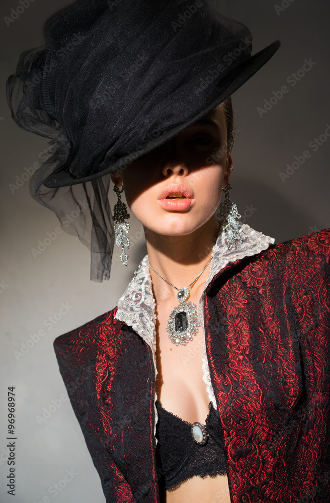 Φωτογραφία Portrait of a woman in a red jacket and jewelry