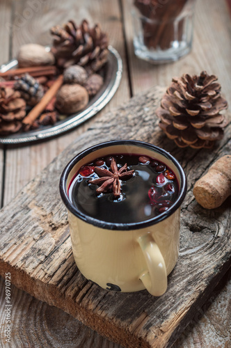 mulled wine from the wine cranage in rustic iron mug photo